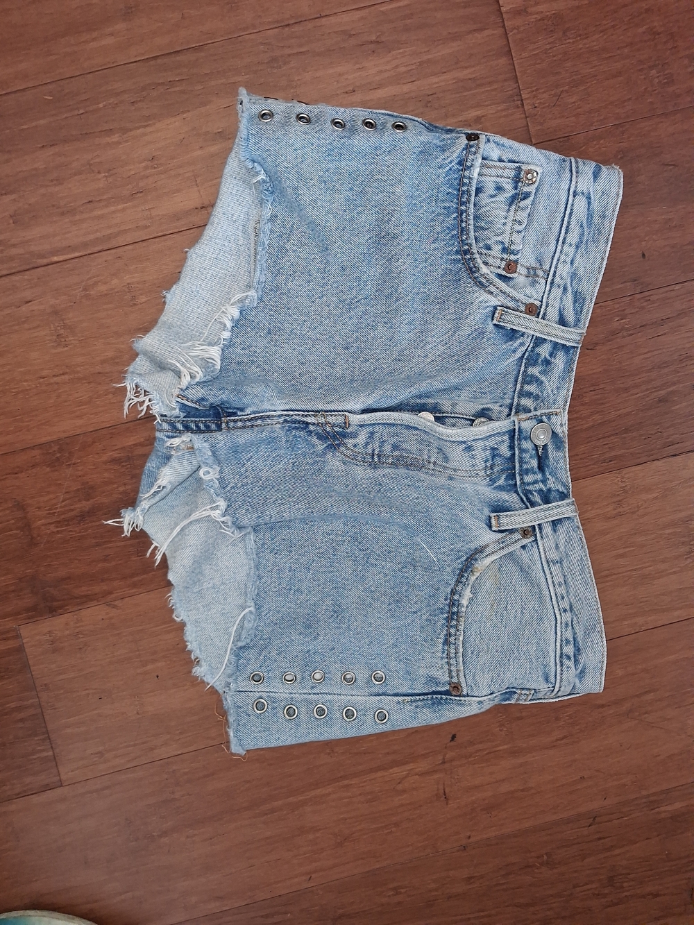Levi's Light Blue Distressed Denim Cutoff Shorts with Grommet Detail